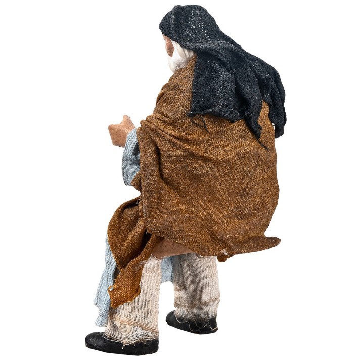 Seated Palestinian man 15 cm series in terracotta with fabric