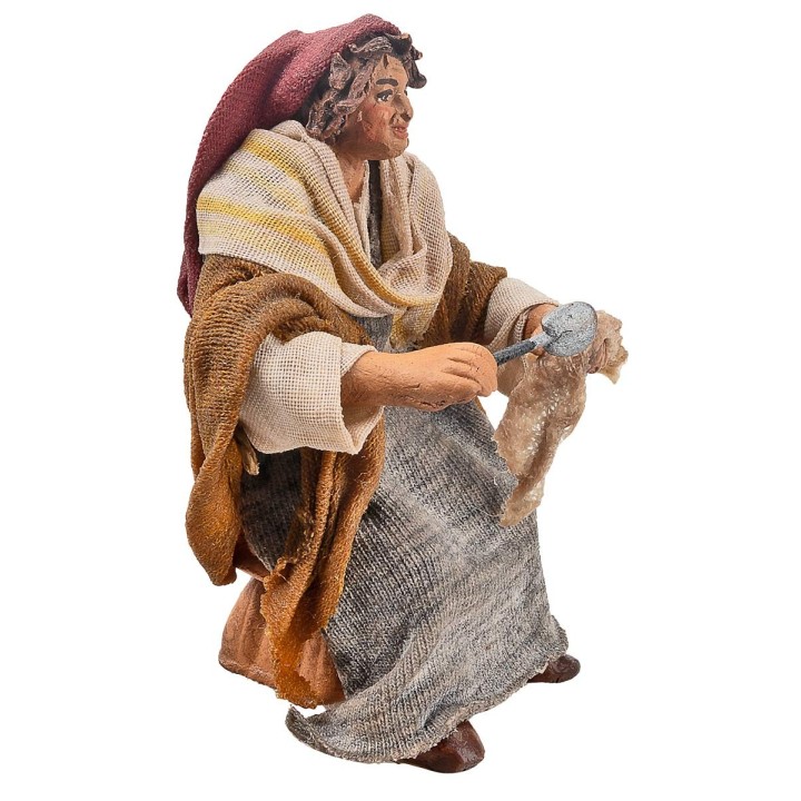 Donna seduta con stoffa serie 10 cm in terracotta con abiti in