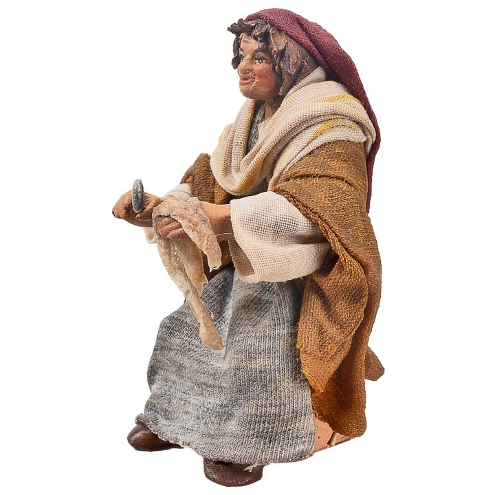 Donna seduta con stoffa serie 10 cm in terracotta con abiti in