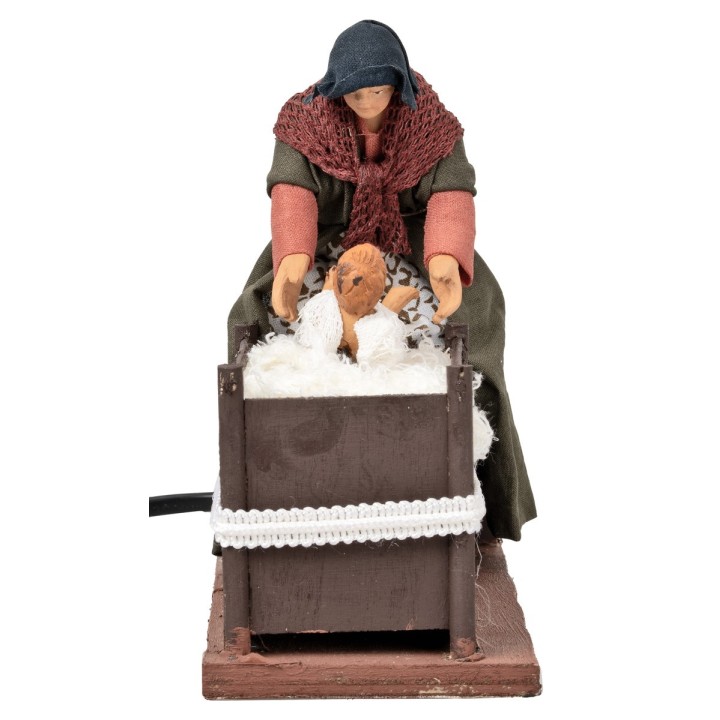 Mujer con niño en la cuna con doble movimiento serie 14 cm