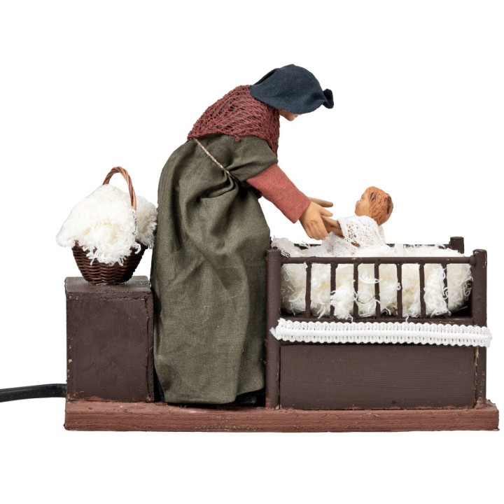 Mujer con niño en la cuna con doble movimiento serie 14 cm