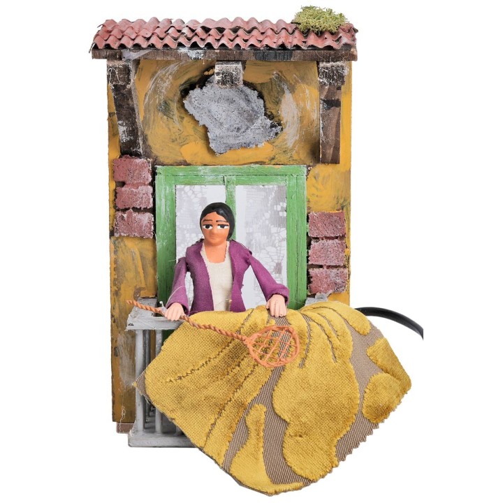 Woman with carpet beater 10 cm in motion