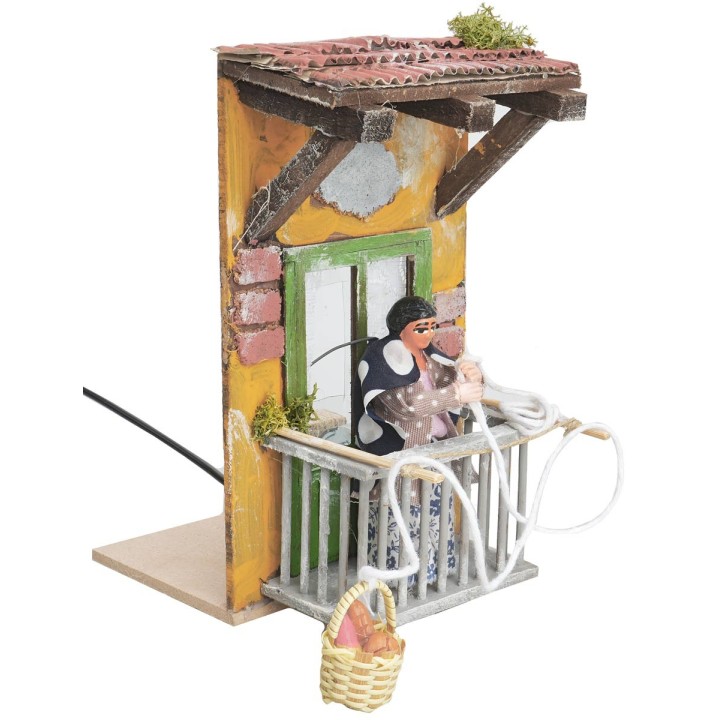 Woman on the balcony with basket 10 cm in motion