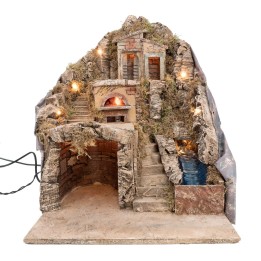 Pesebre iluminado con horno y arroyo que funcionan con