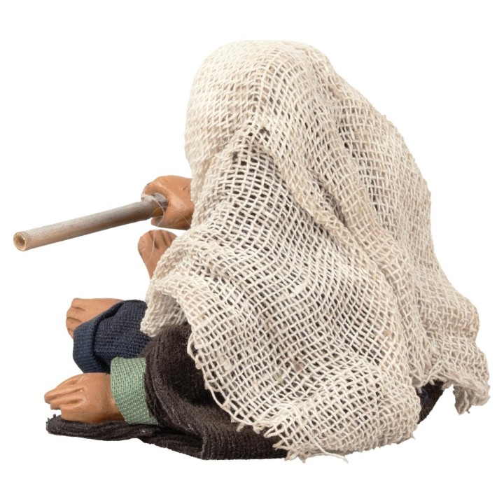 Seated man stoking the fire series 12 cm