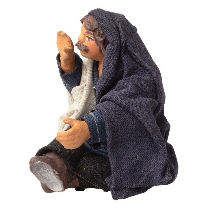 Vendedor sentado que llama con la mano a la boca serie 10 cm