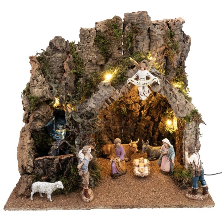 Illuminated nativity scene with stable made of cork bark and